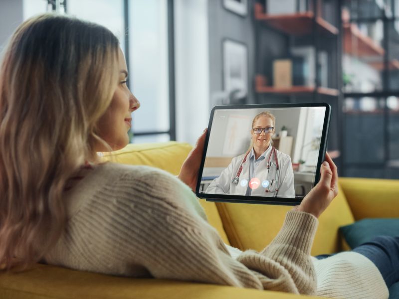 Person video chatting with a fertility doctor in california